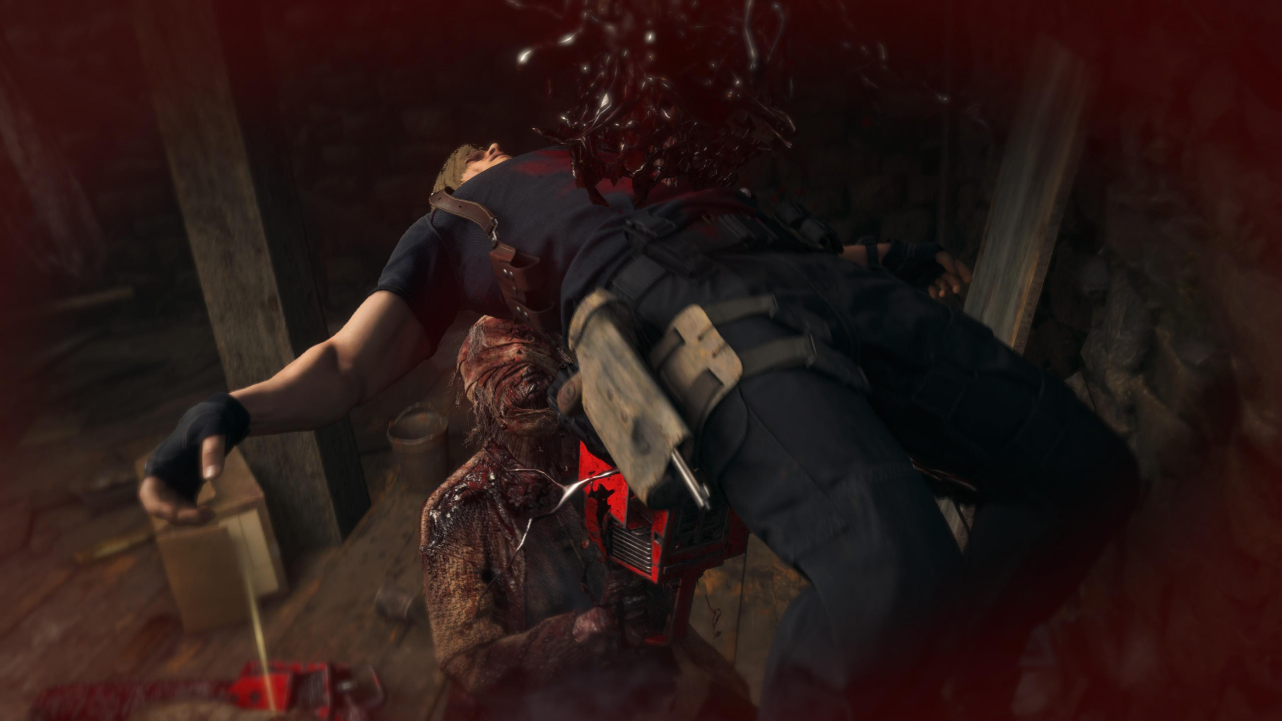 Leon Kennedy killed in action by a heavily infected villager. A chainsaw through the back comes out of his chest as blood sprays upwards.