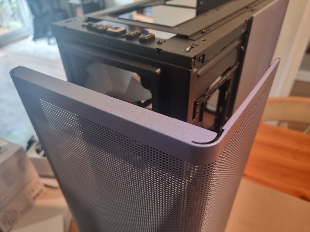 photo showing the L shaped front and side panel removed from the main case slightly. The chromaflair blue and purple pearlescent colour is very striking.
