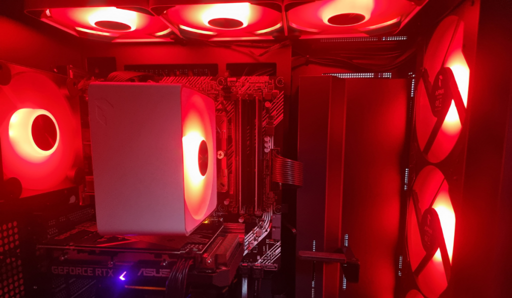 Photo showing the inside of the APNX pc case lit up in red.